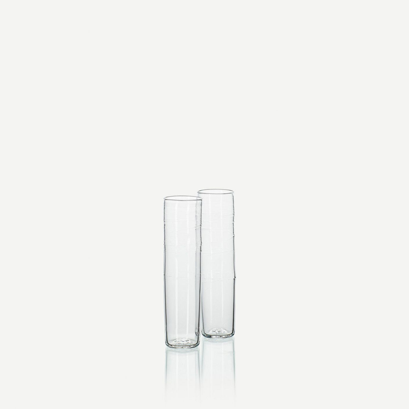 a pair of clear glass champagne flutes