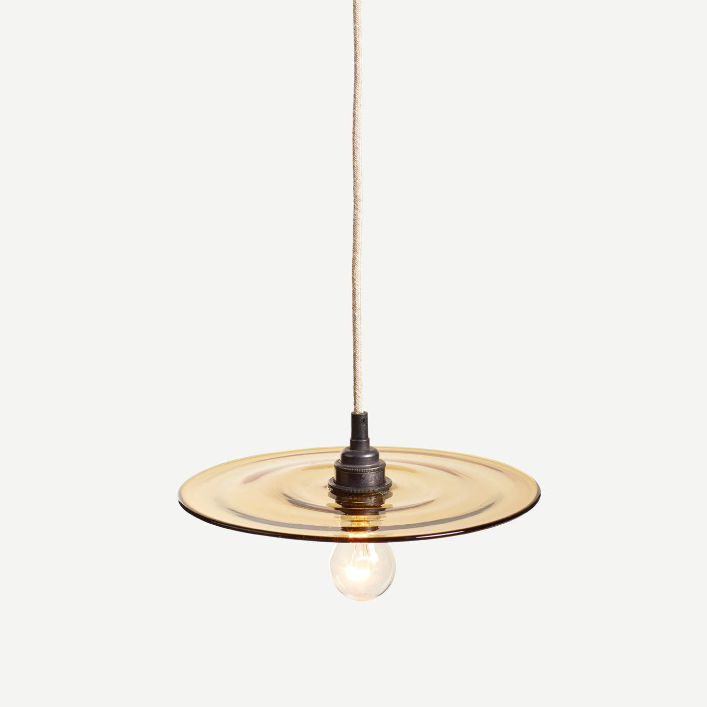 pendant light made from a glass disc