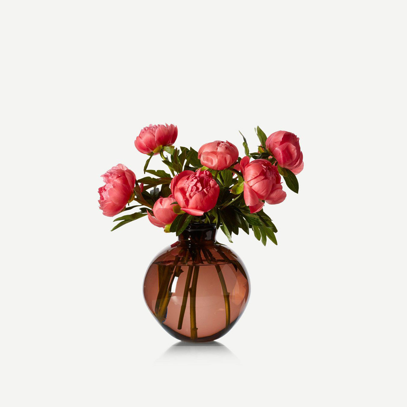 flowers in hand-handblown glass vase