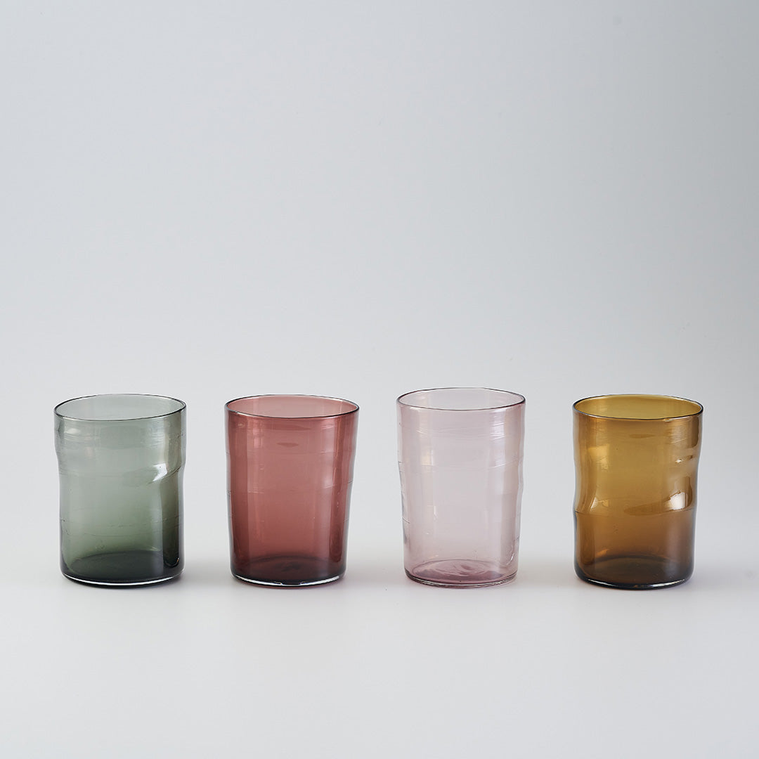 a set of four blown glass water glasses
