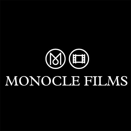 Black and white logo of Moncocle films featuring a white letter inside a circle on a black background.