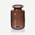 Tall brown apothecary glass flower jar
