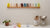 Glass Coloured Tumblers on a wooden wall rack
