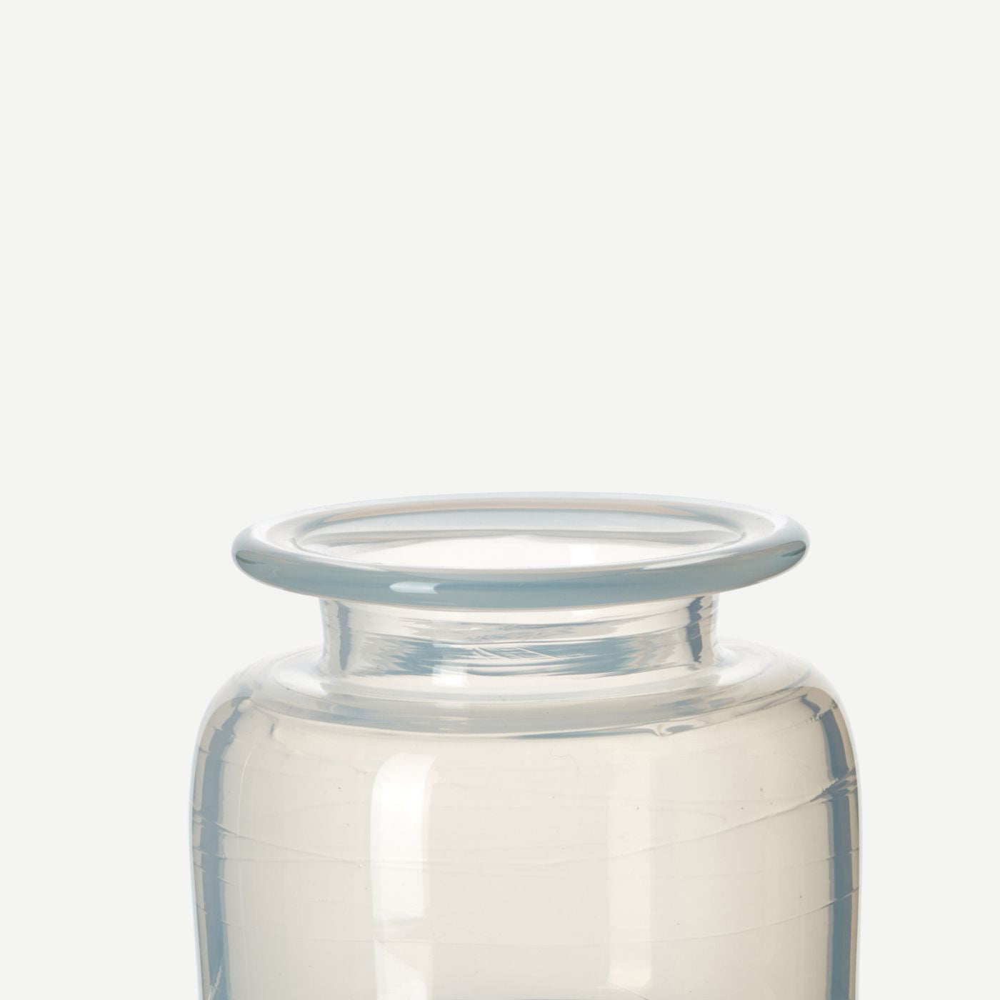 detail of handblown white glass jar vase